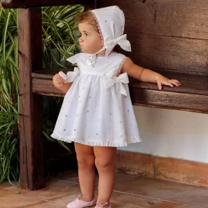 Conjunto vestido, braguita y capota perforado rosa lazos bebé | Cocote by Charanga