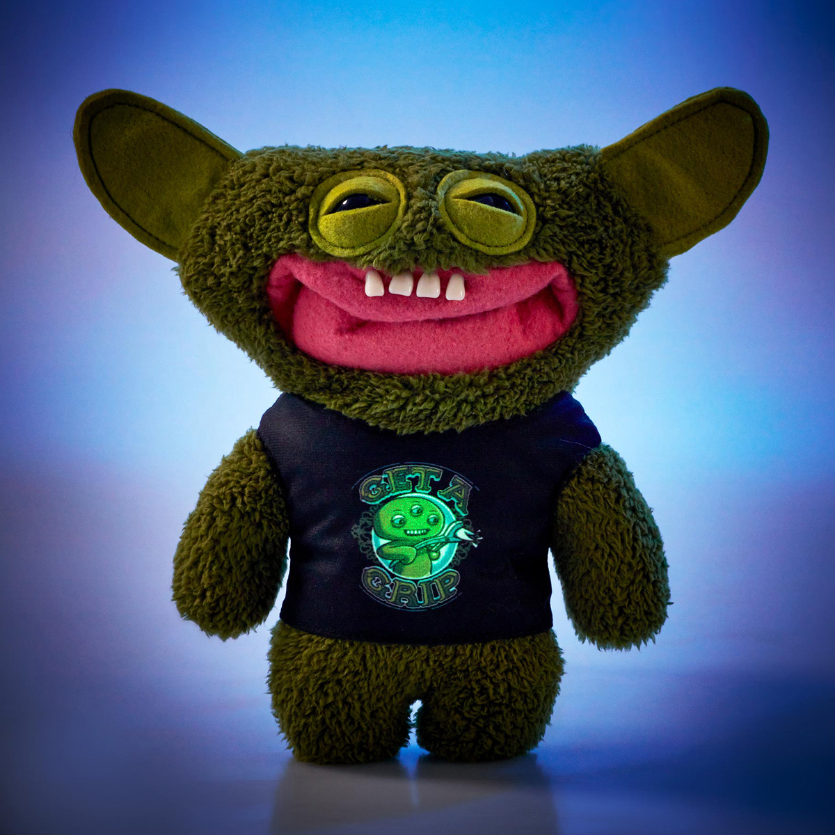 FUGGLER – Fuggler Grin Grin FuggGlow Edition | Peluche brilla en la oscuridad - Imagen 4