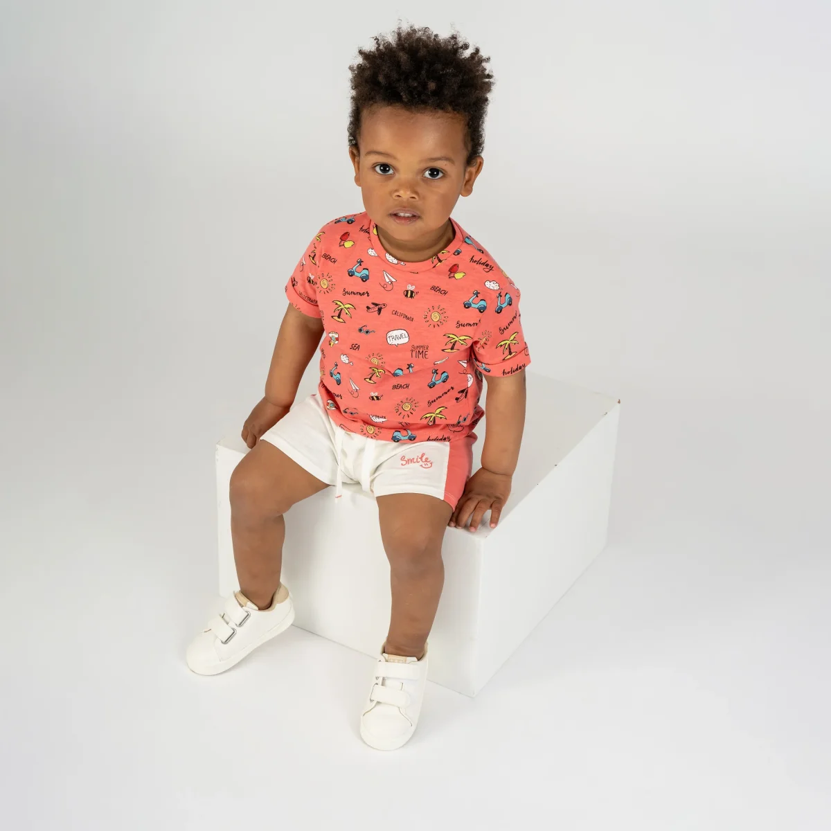 Camiseta bebé coral estampado holiday