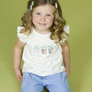 Camiseta bebé niña crudo con volantes bordados y estampado “Hello Spring”