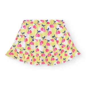 Falda niña amarilla con estampado de cerezas